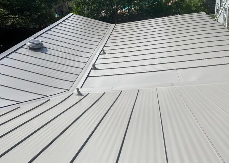 Solar attic fan installed on a metal roof for Roof Ventilation in Mulvane